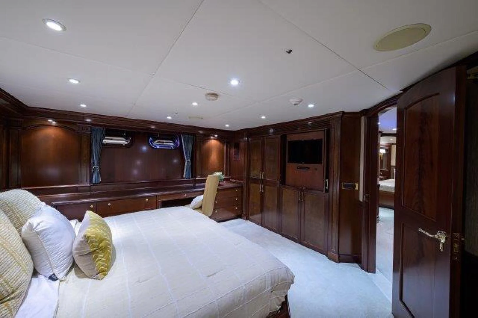 a bedroom with a bed and a closet aboard REBECCA Yacht for Sale