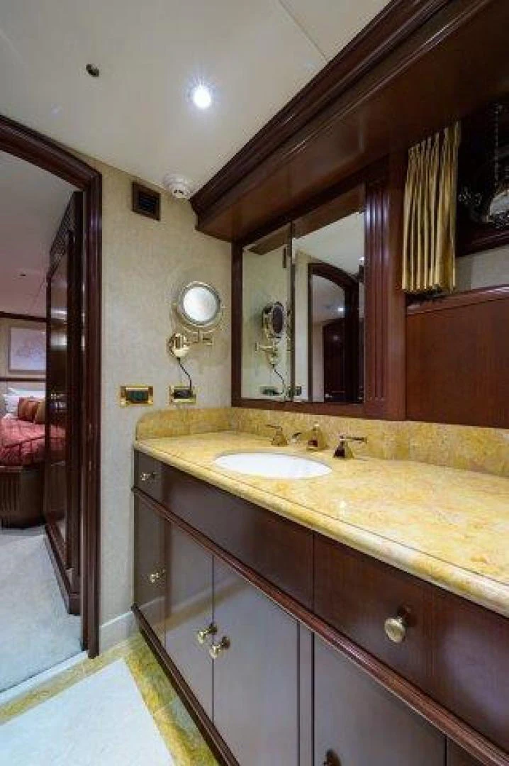 a bathroom with a sink and a mirror aboard REBECCA Yacht for Sale