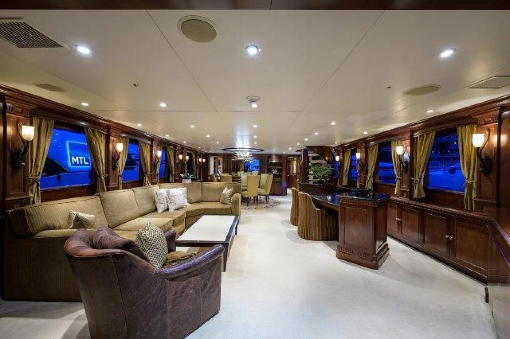 a living room with a couch and a coffee table aboard REBECCA Yacht for Sale