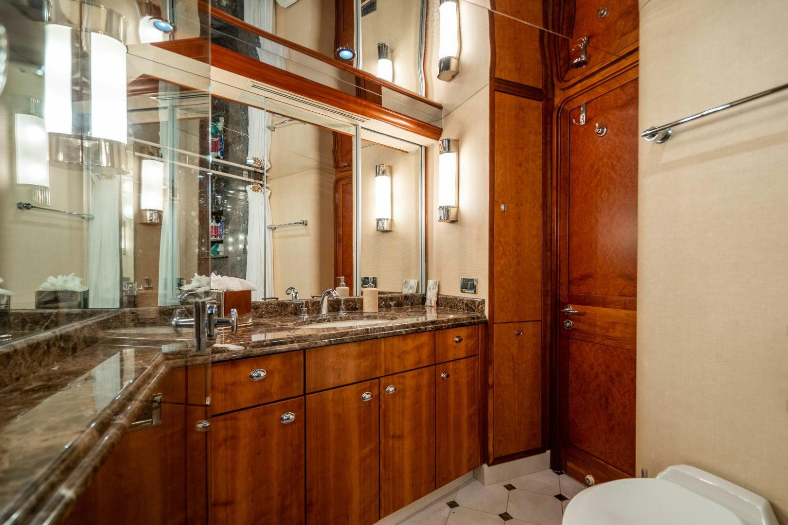 a bathroom with a large mirror aboard LEGACY Yacht for Sale