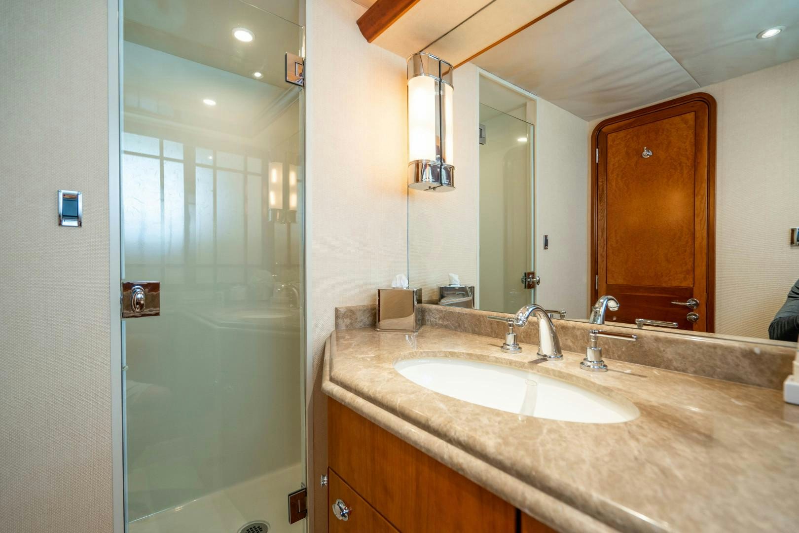 a bathroom with a large mirror aboard LEGACY Yacht for Sale