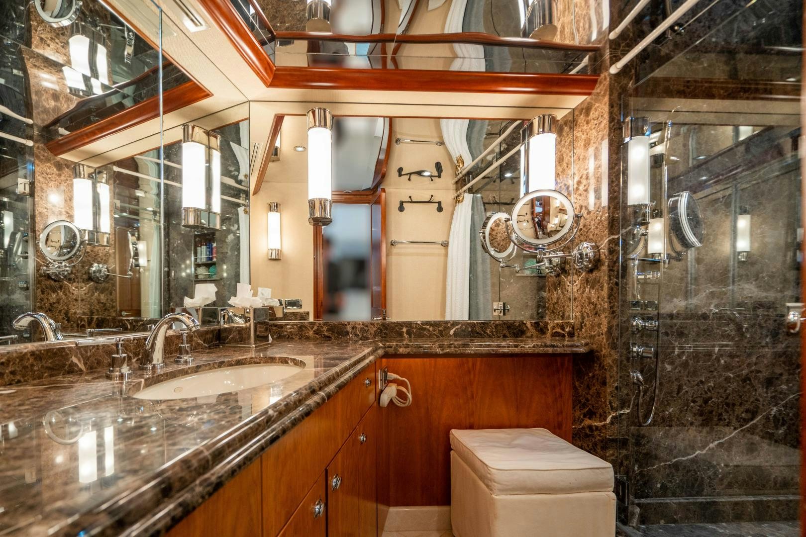 a bathroom with a large mirror aboard LEGACY Yacht for Sale