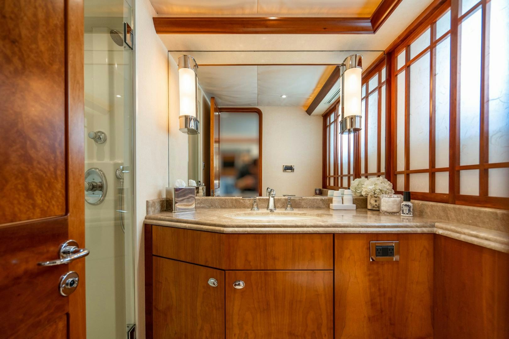 a bathroom with a large mirror aboard LEGACY Yacht for Sale