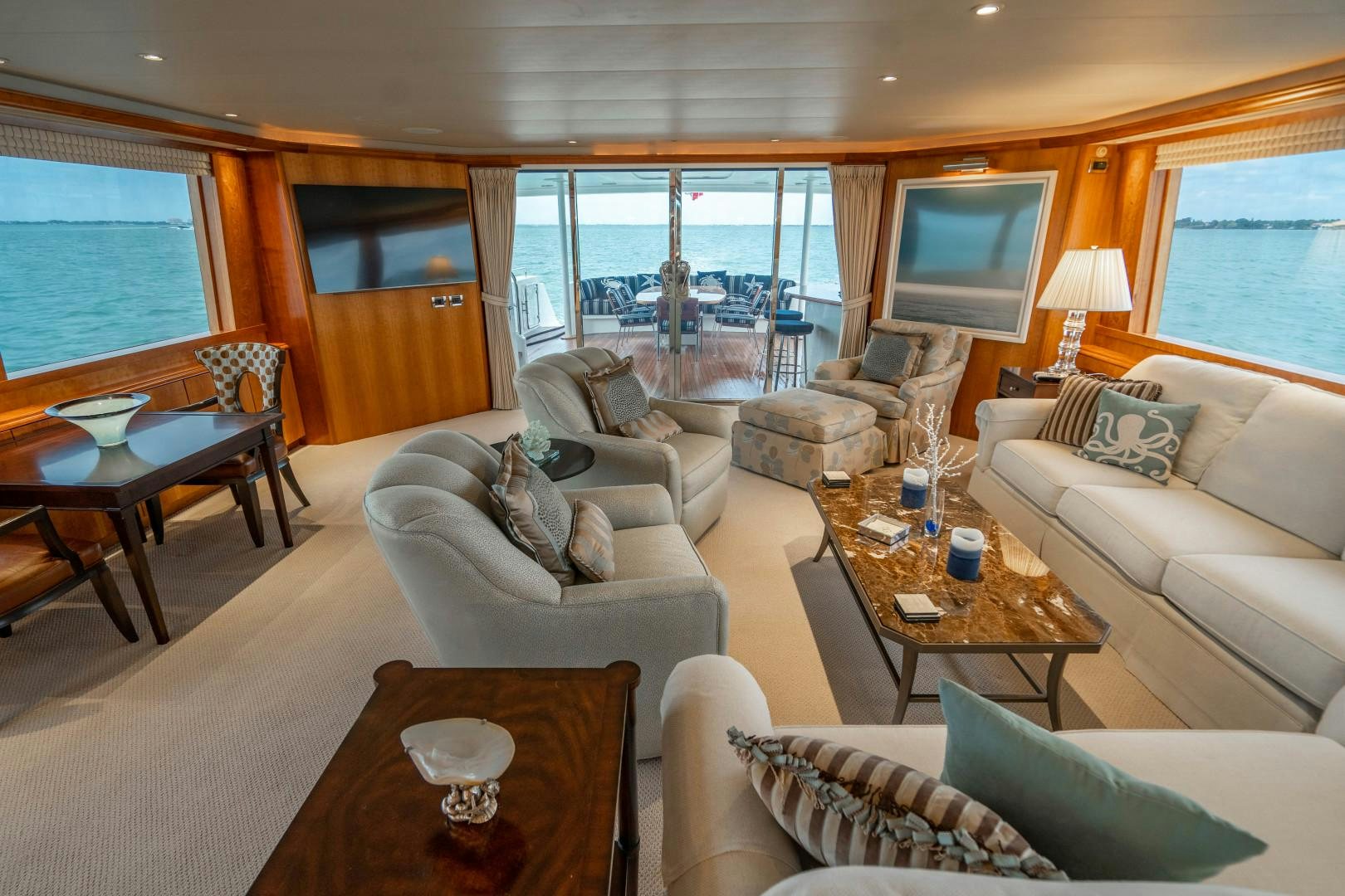 a living room with a large window aboard LEGACY Yacht for Sale