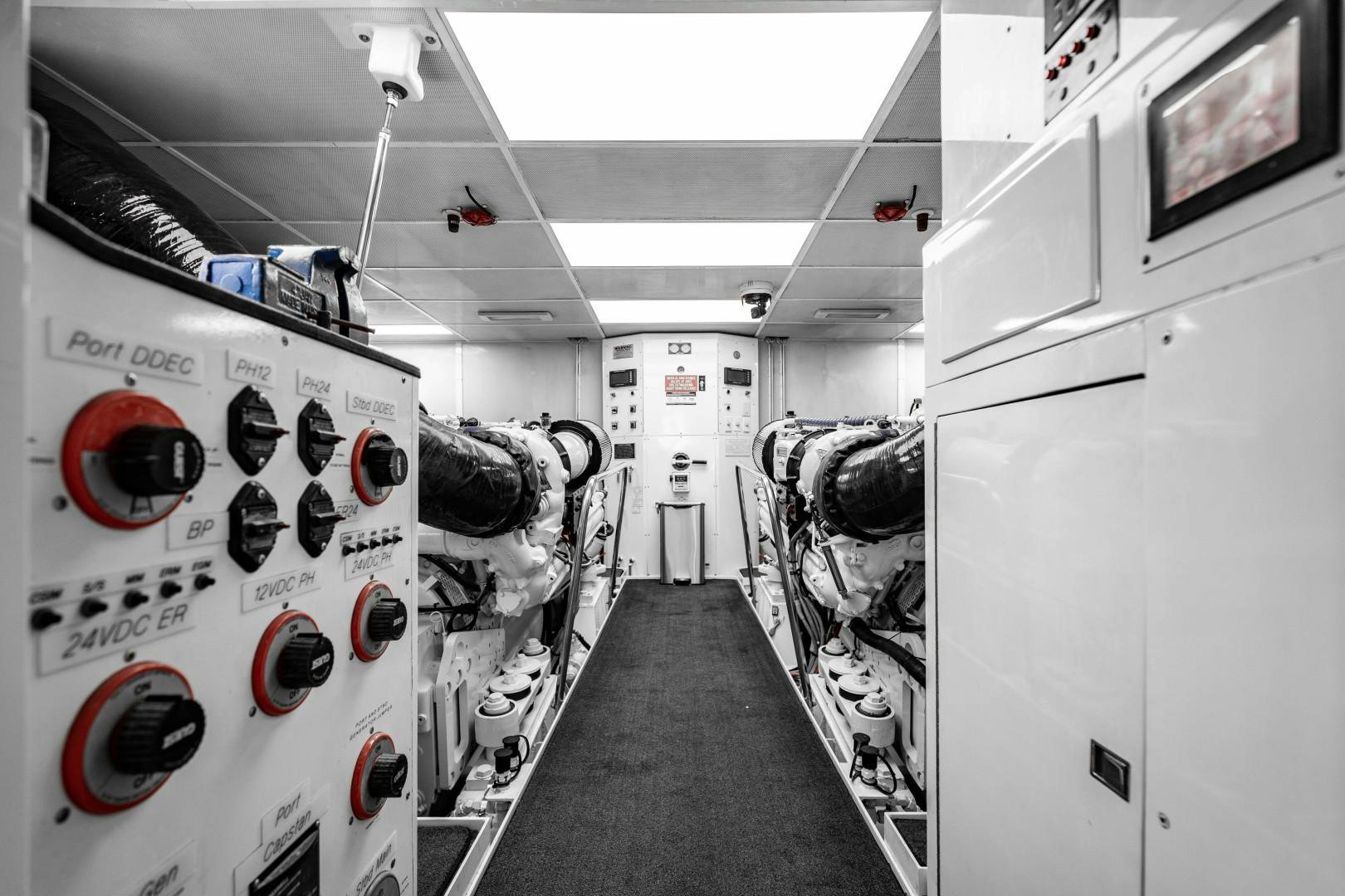 a hallway with white walls and red lights aboard LEGACY Yacht for Sale