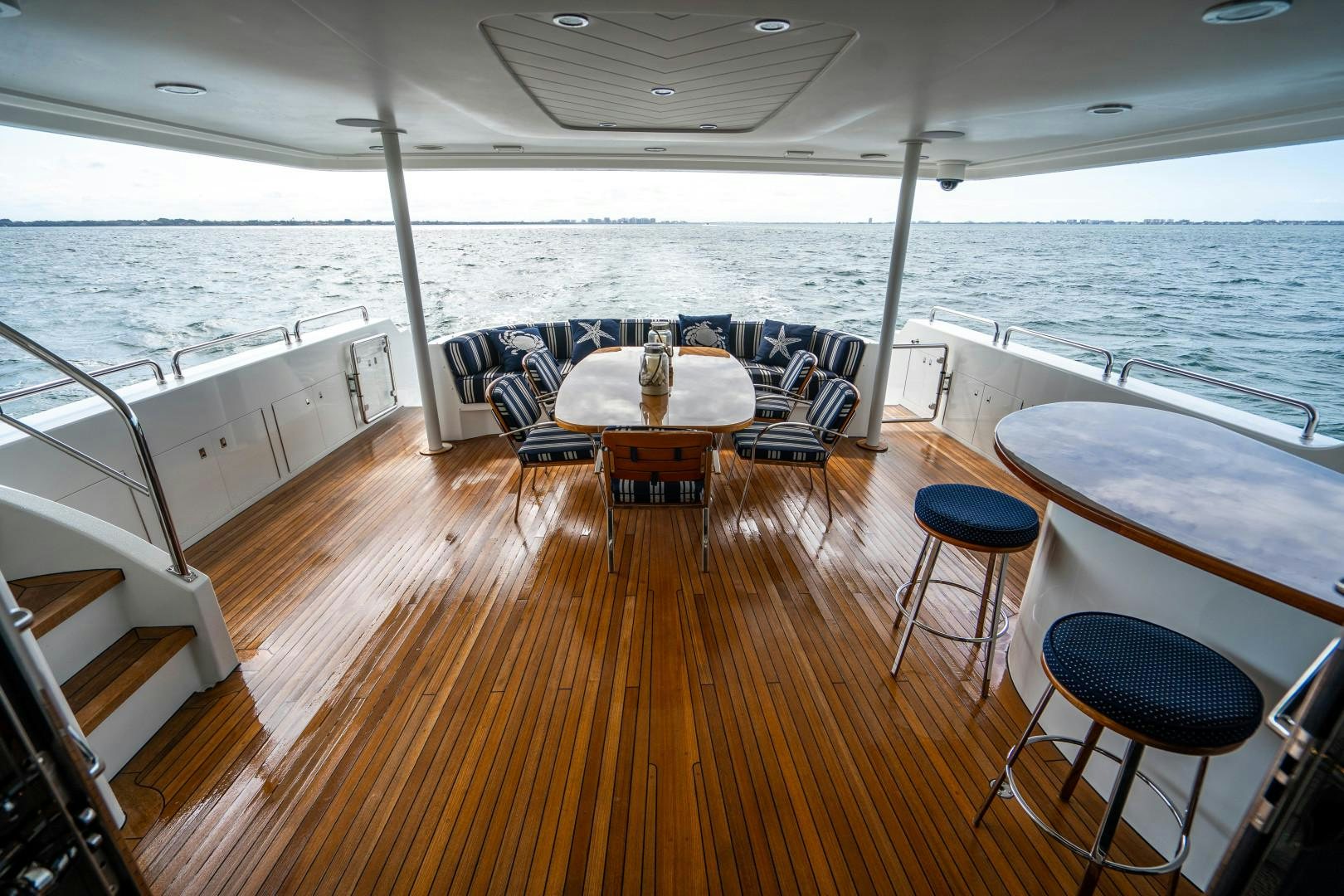 a room with a table and chairs aboard LEGACY Yacht for Sale