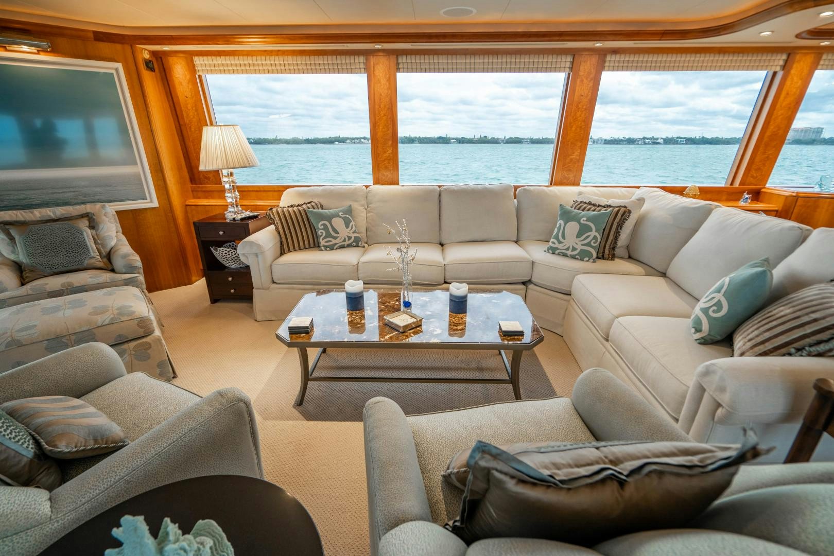 a living room with a large window aboard LEGACY Yacht for Sale