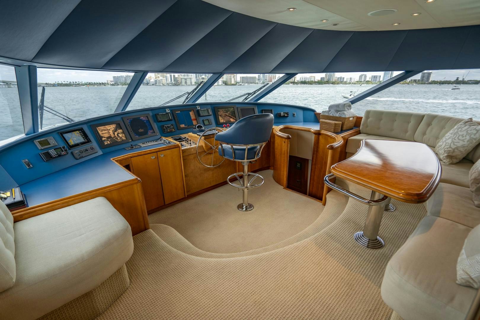 a room with a view of the ocean and a large boat aboard LEGACY Yacht for Sale