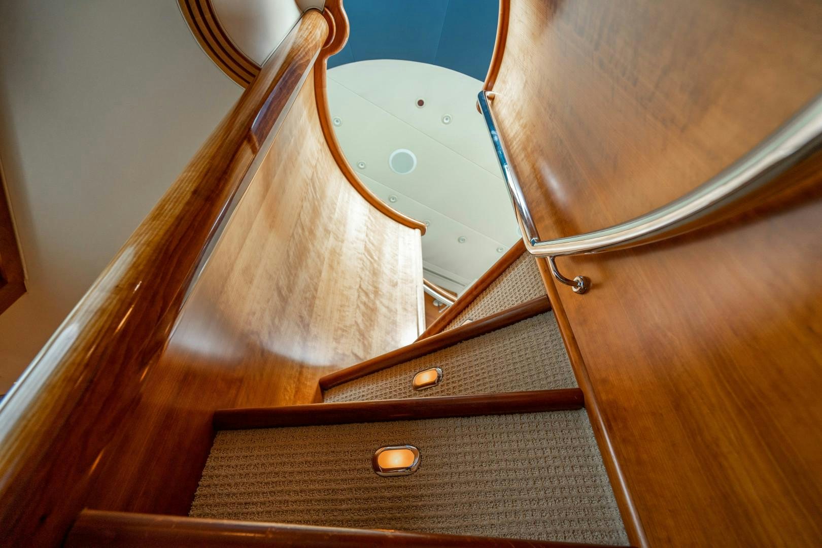 a wooden guitar leaning against a wall aboard LEGACY Yacht for Sale