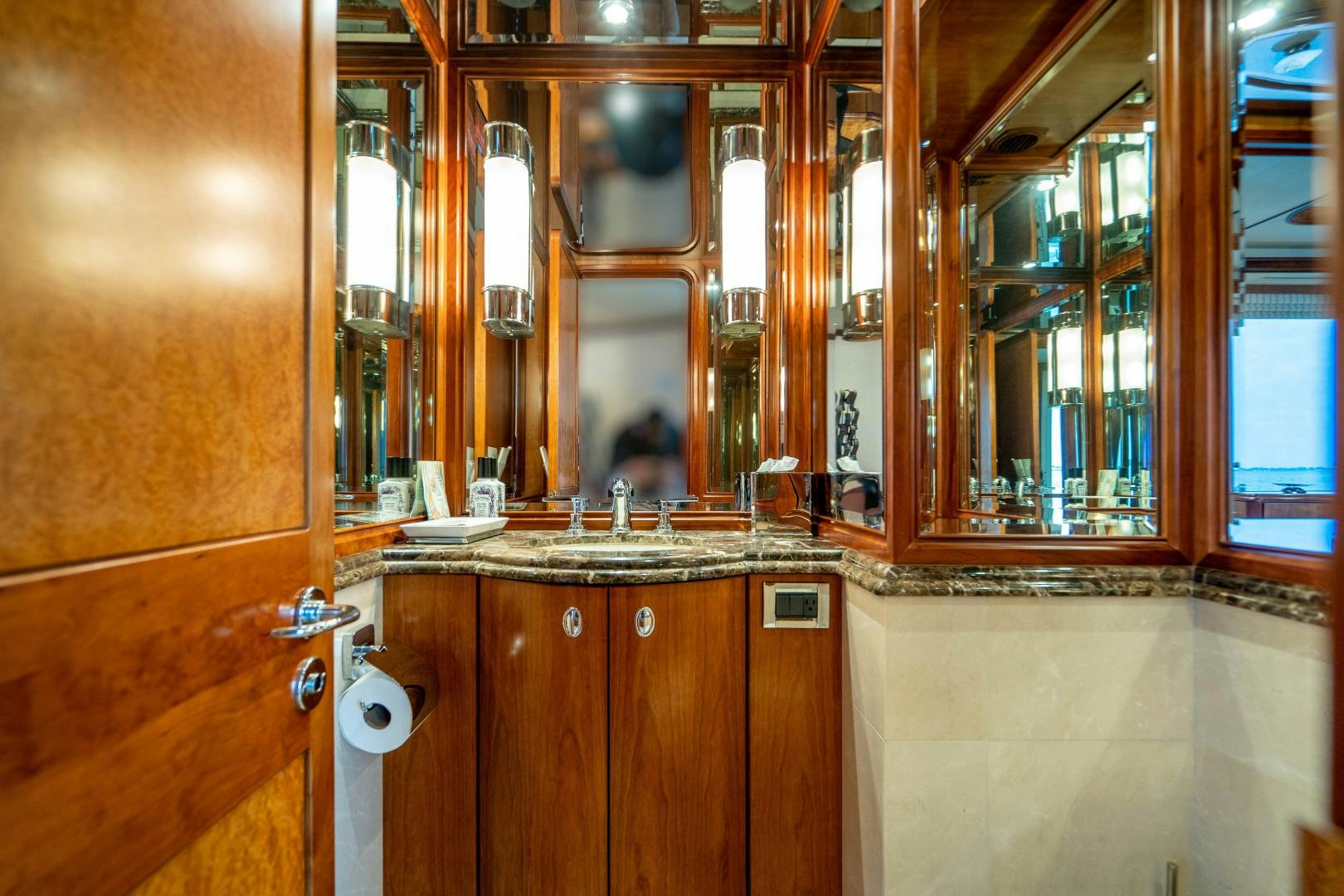a bathroom with a large mirror aboard LEGACY Yacht for Sale