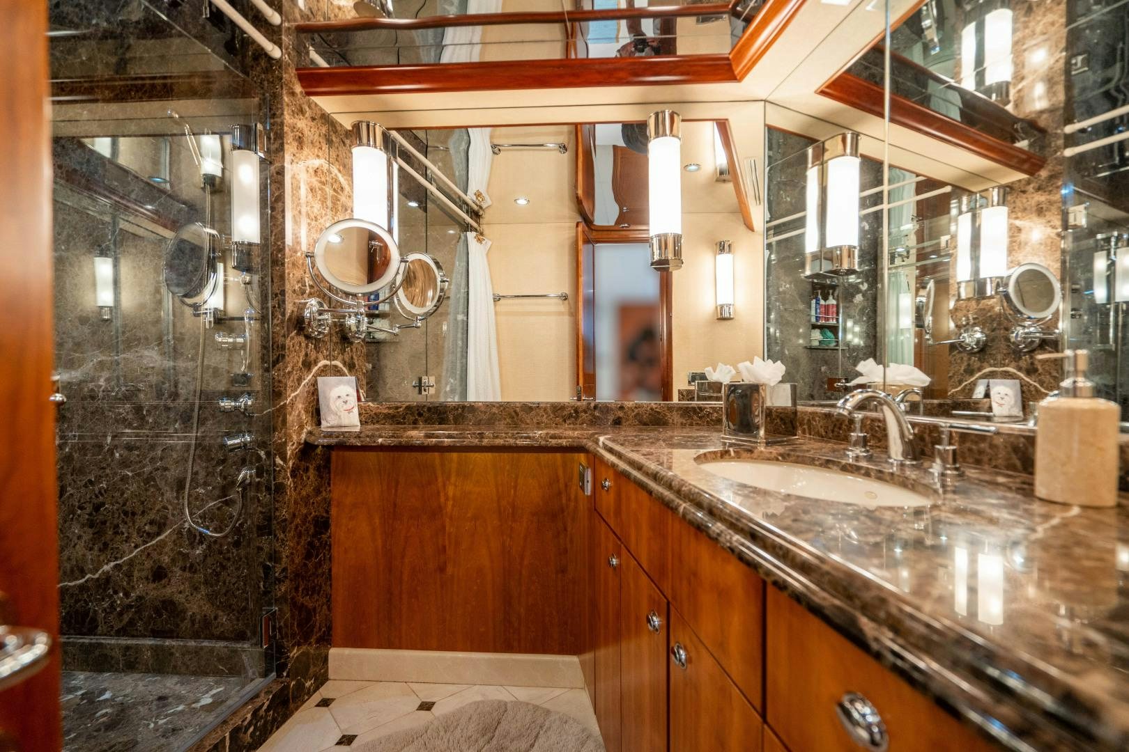 a bathroom with a large mirror aboard LEGACY Yacht for Sale