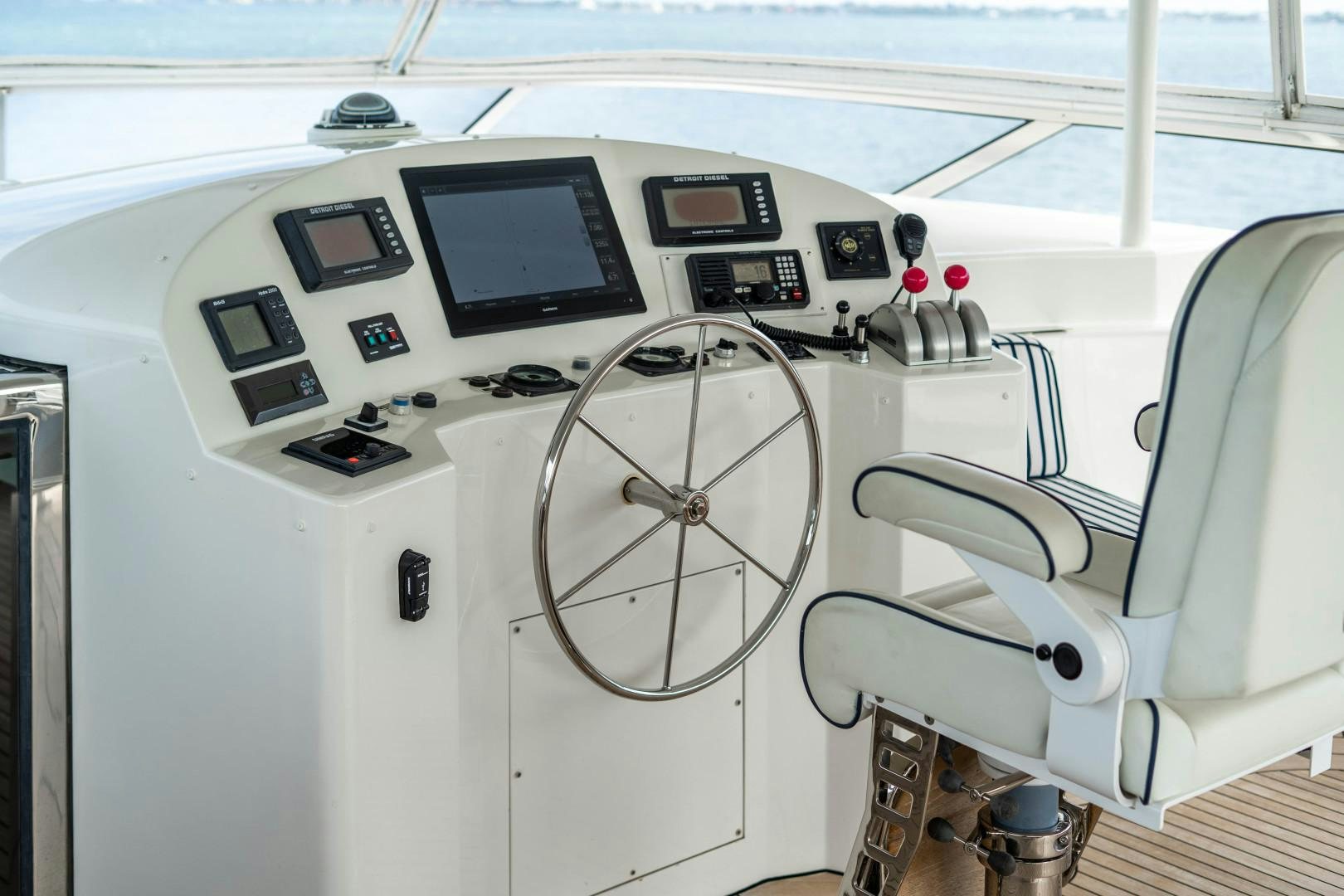 the inside of a white car aboard LEGACY Yacht for Sale