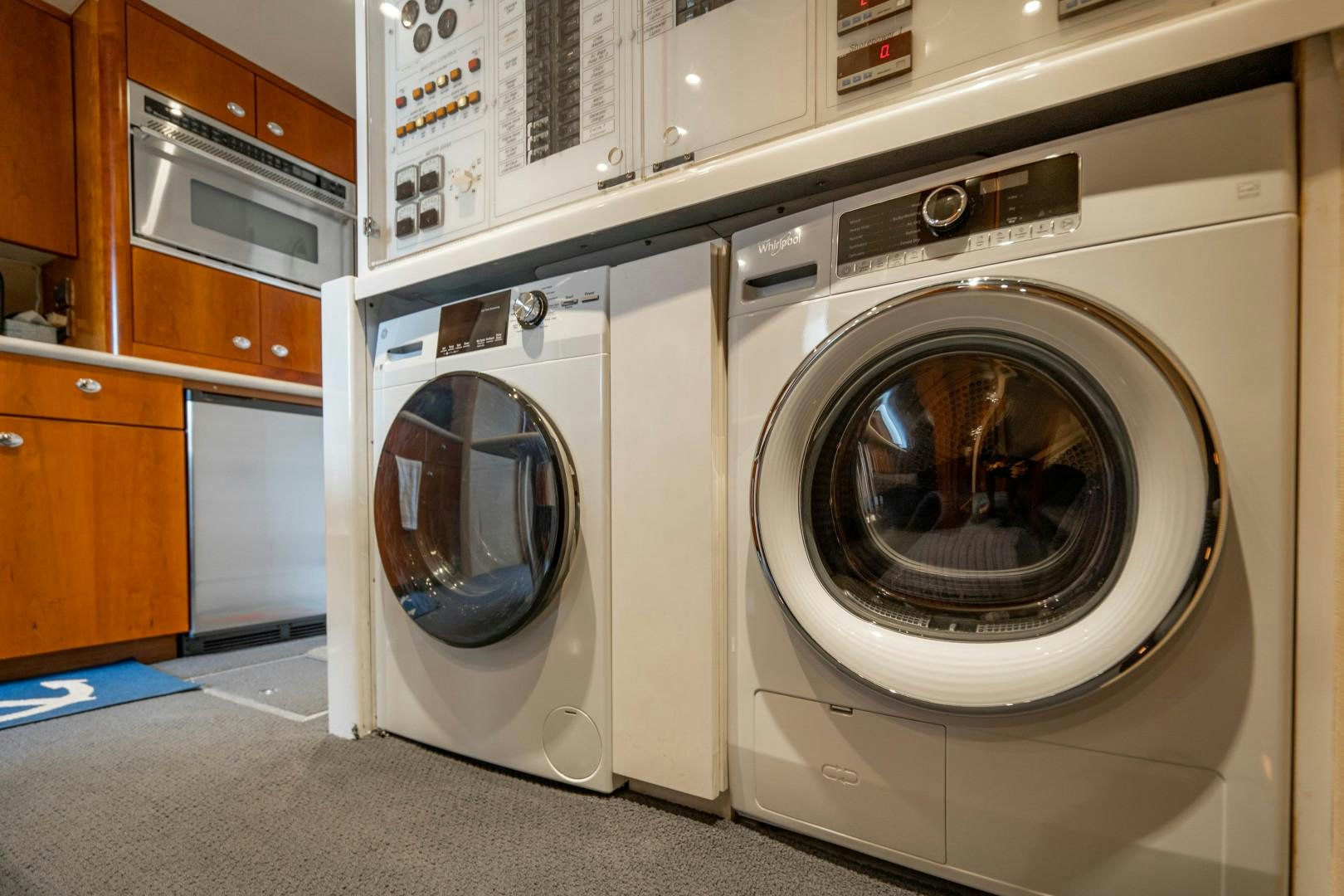 a washing machine in a room aboard LEGACY Yacht for Sale