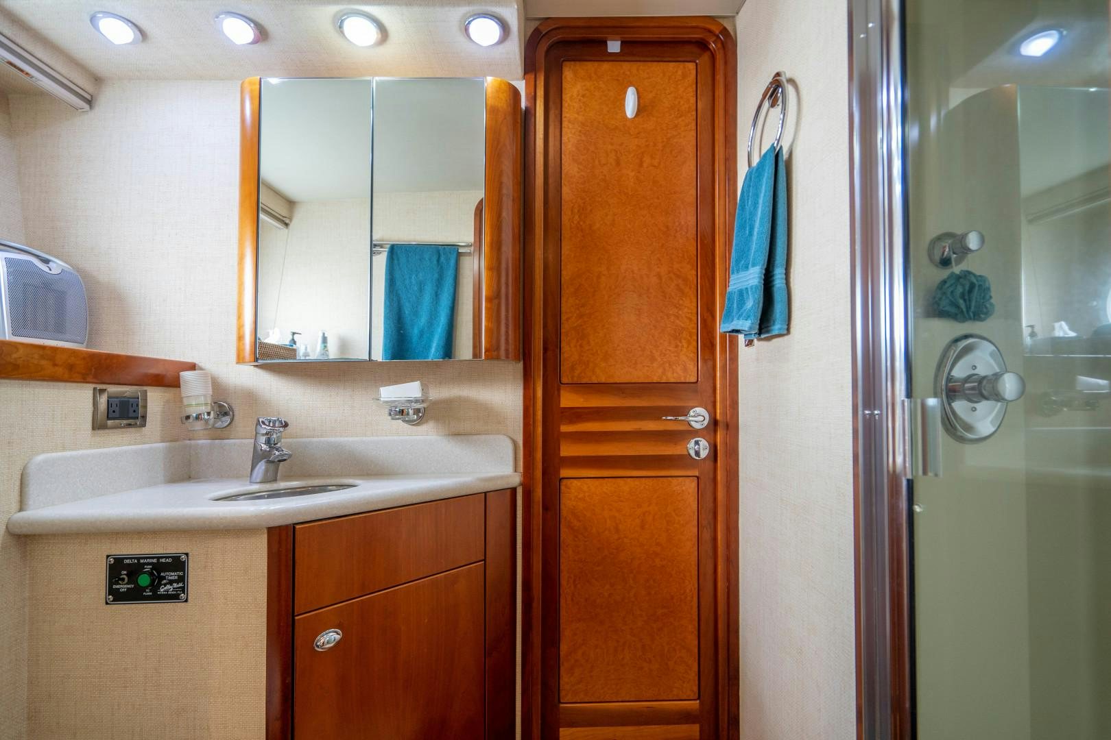 a bathroom with a sink and a mirror aboard LEGACY Yacht for Sale