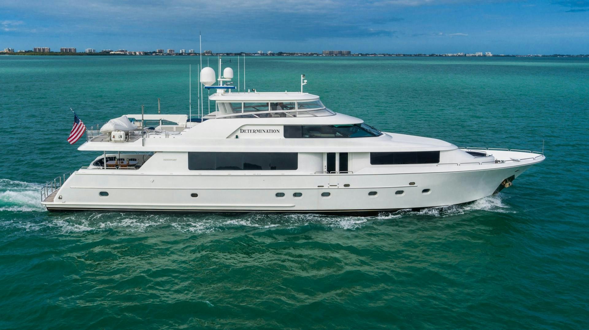 a white yacht in the water aboard LEGACY Yacht for Sale