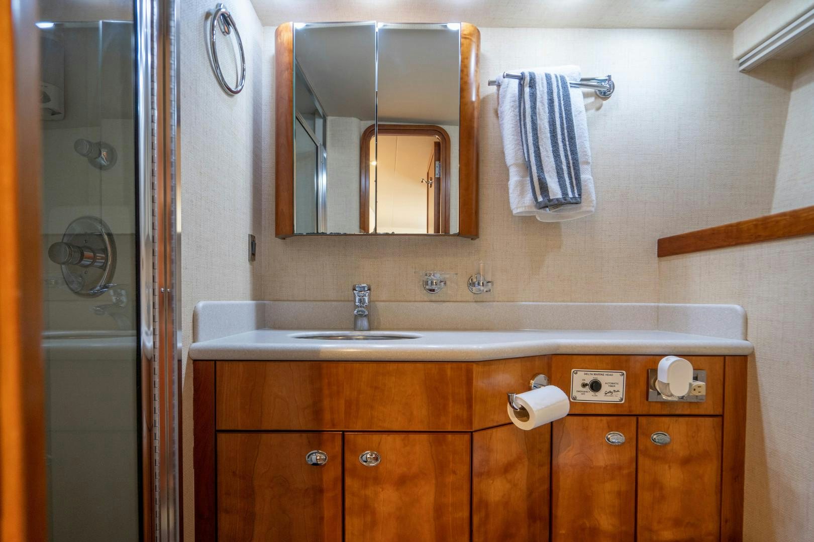 a bathroom with a sink and mirror aboard LEGACY Yacht for Sale