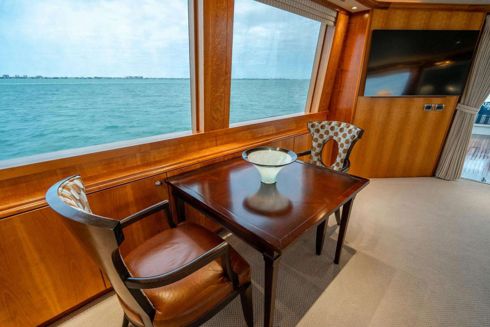 a table with two cups on it aboard LEGACY Yacht for Sale