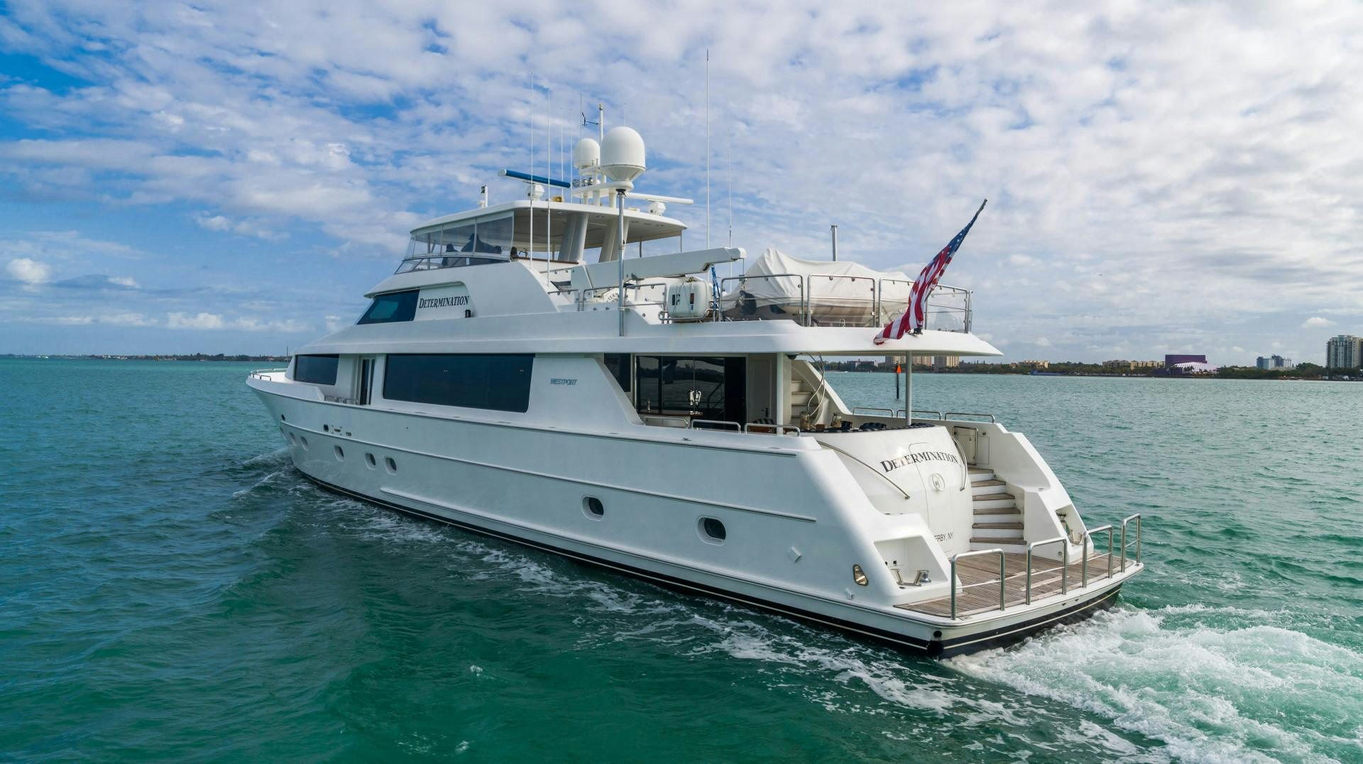 a white boat in the water aboard LEGACY Yacht for Sale