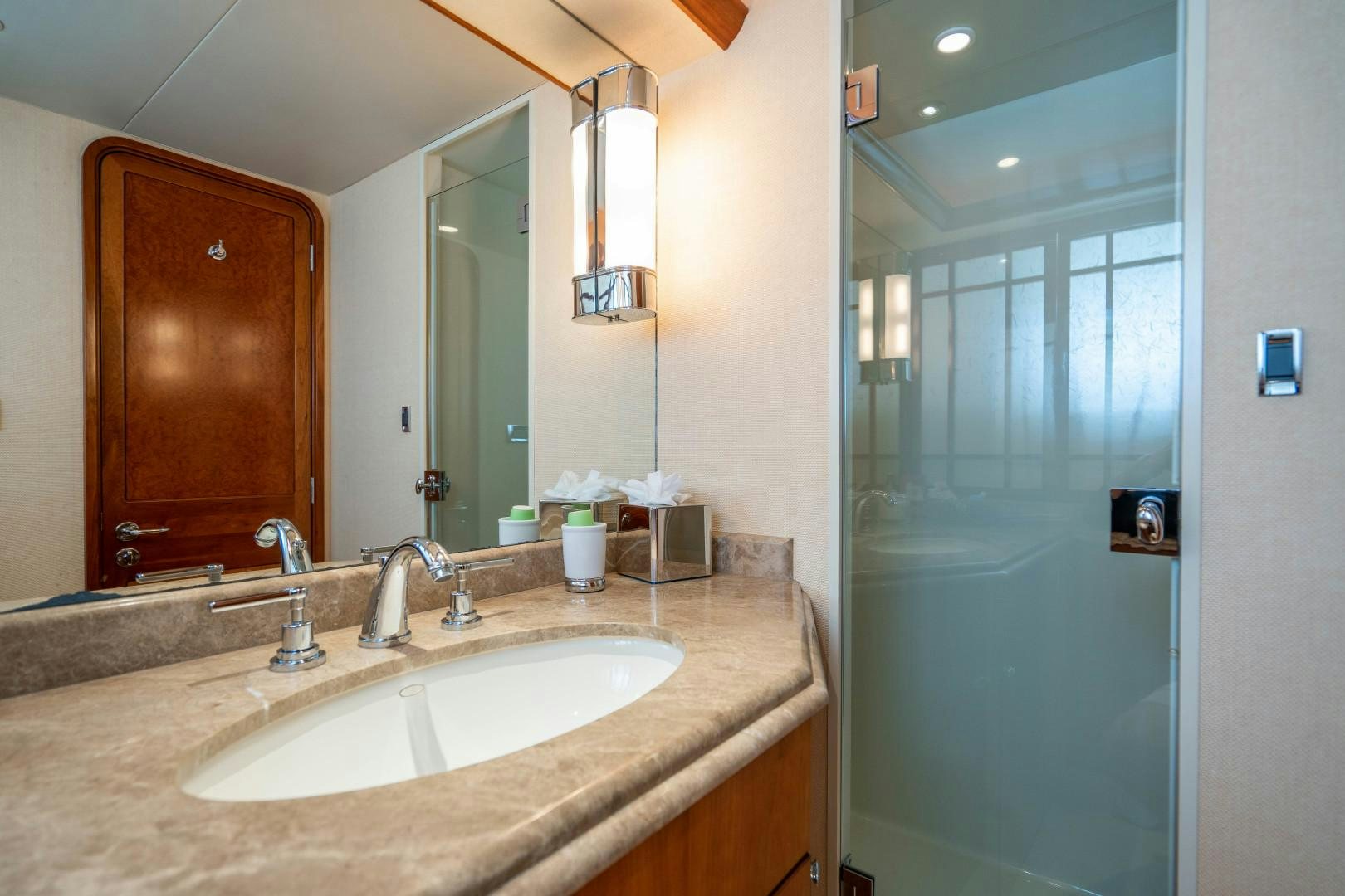 a bathroom with a sink and a mirror aboard LEGACY Yacht for Sale