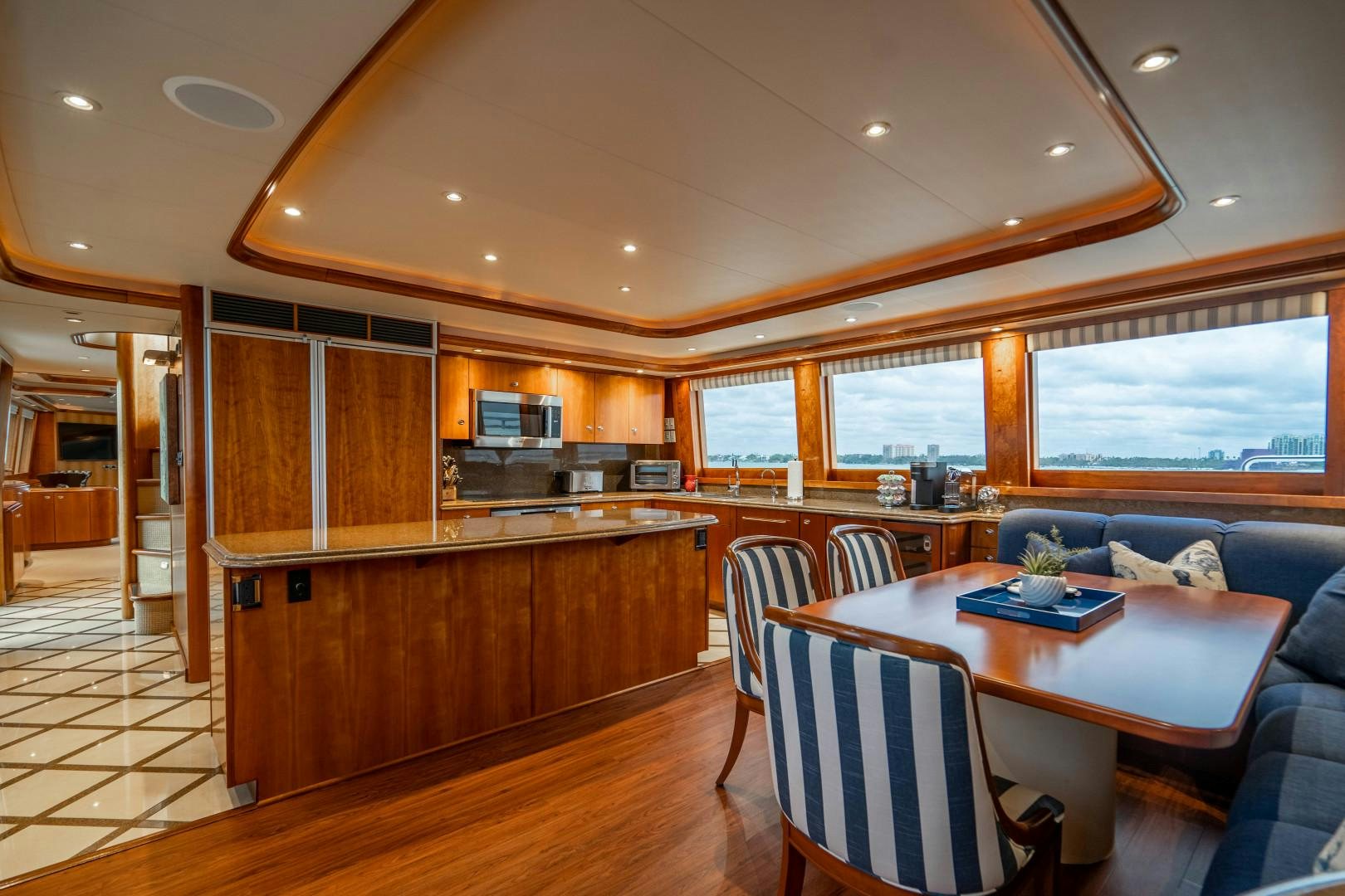 a kitchen and dining area aboard LEGACY Yacht for Sale