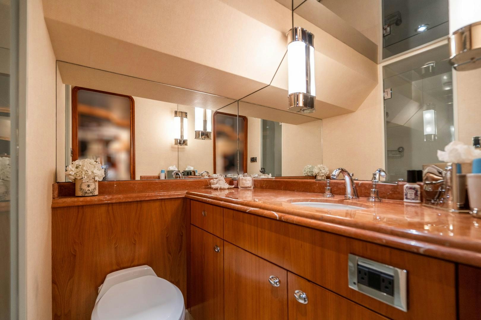 a bathroom with a sink and a mirror aboard LEGACY Yacht for Sale