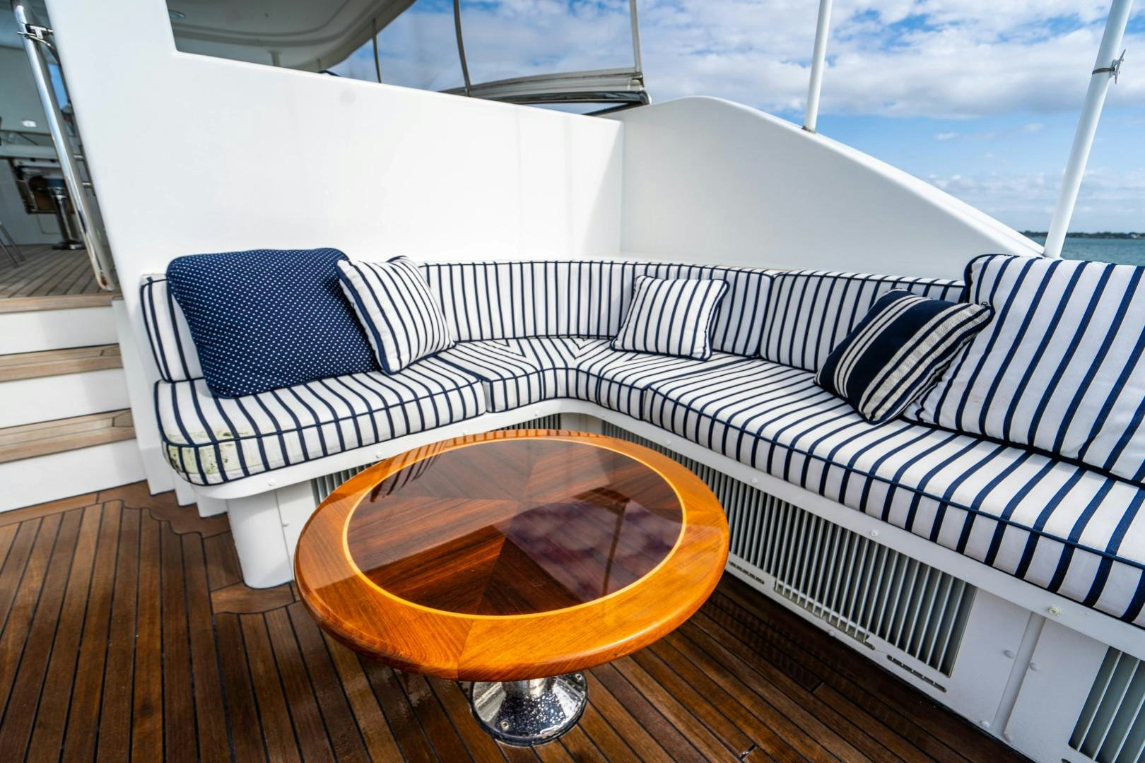 a bed with a chair on it aboard LEGACY Yacht for Sale