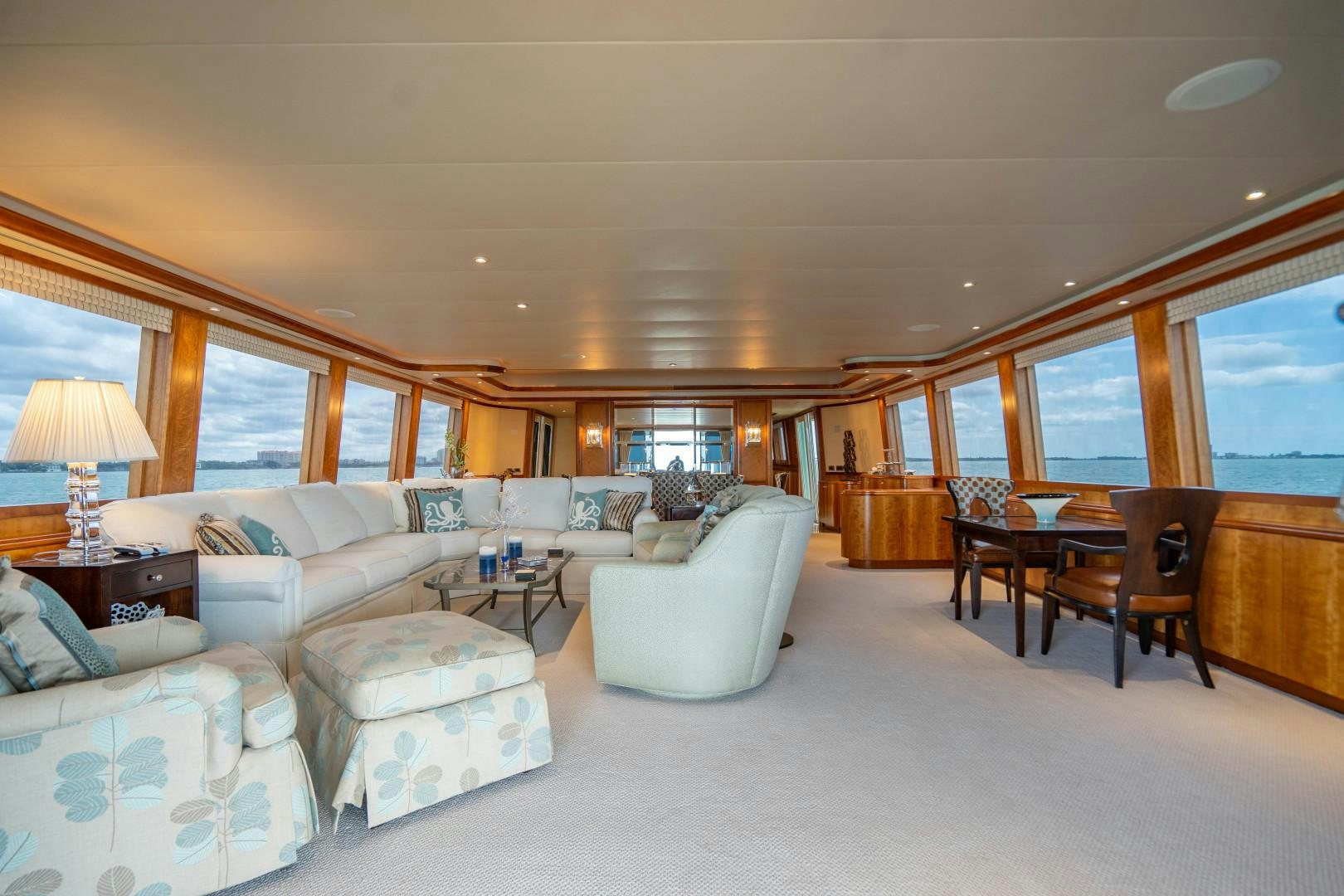 a living room with a large window aboard LEGACY Yacht for Sale