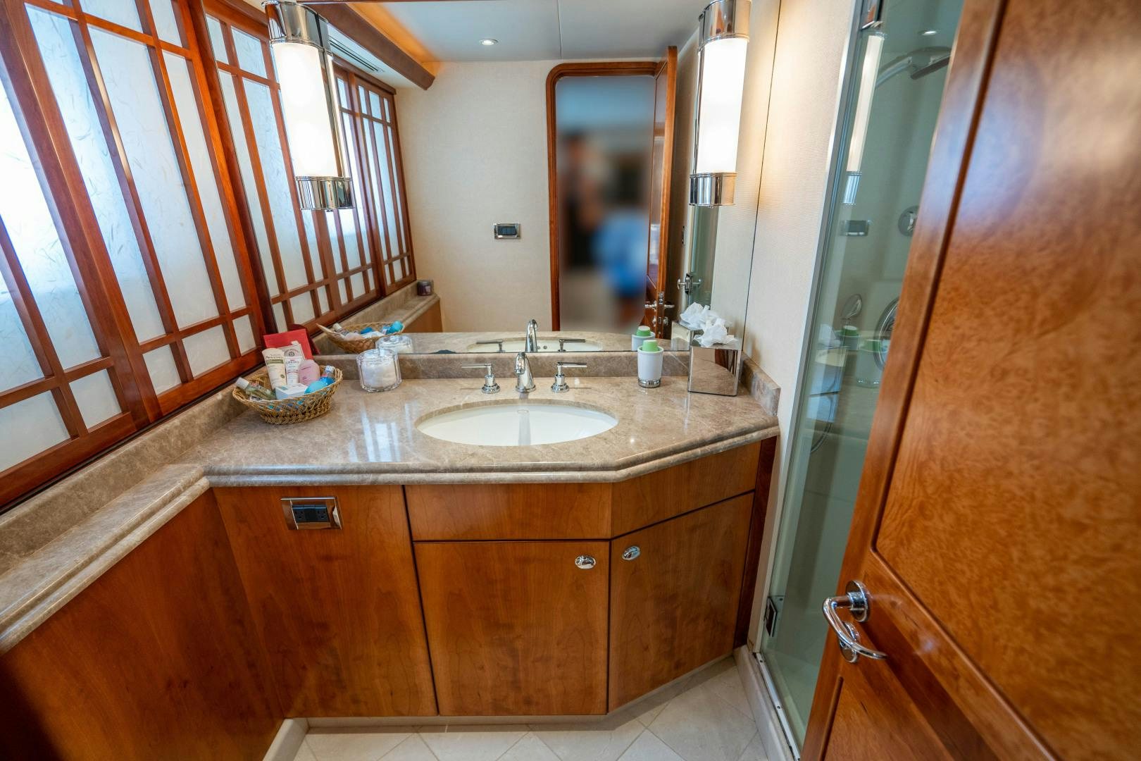 a bathroom with a sink and a mirror aboard LEGACY Yacht for Sale