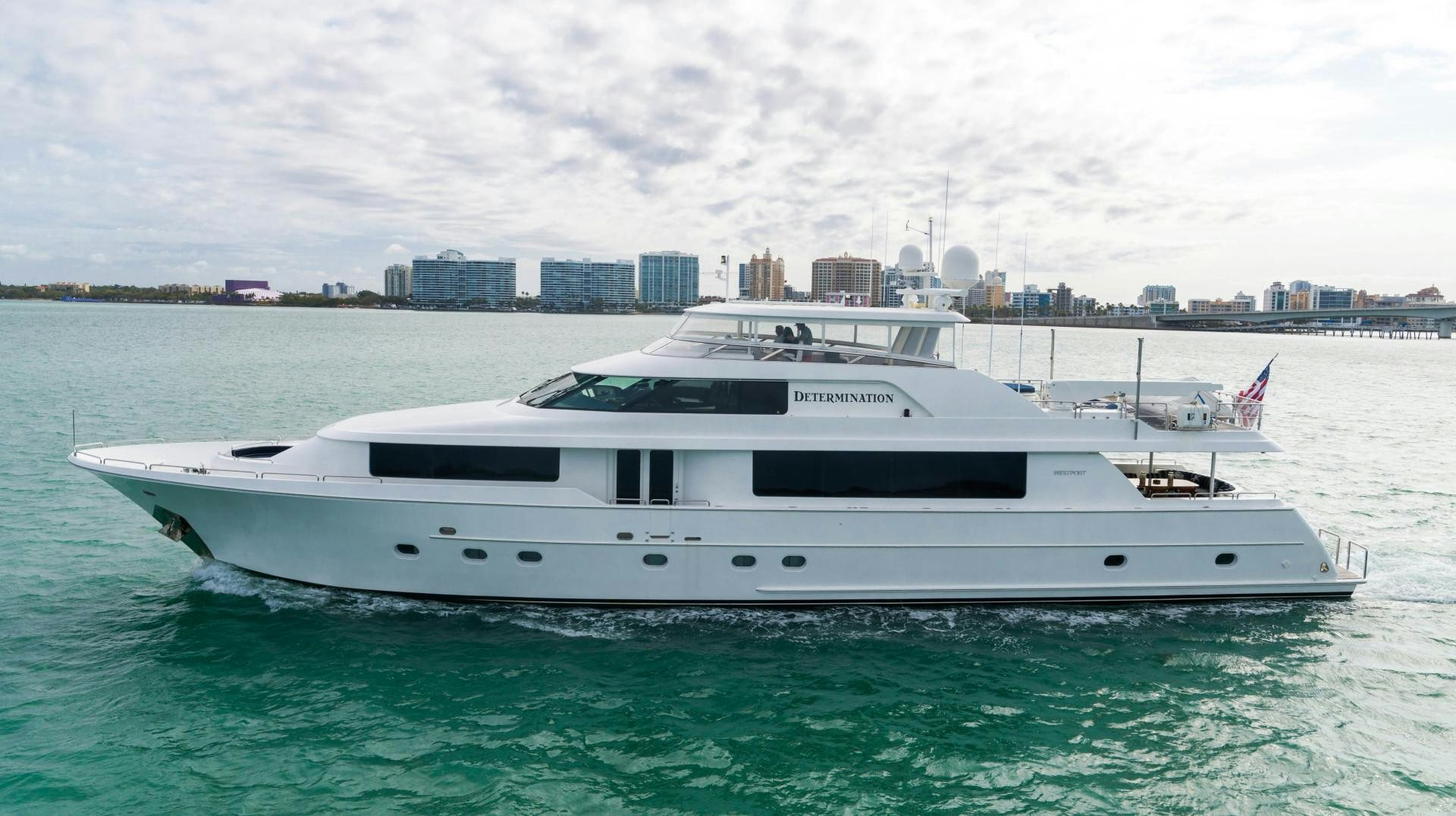 a white yacht in the water aboard LEGACY Yacht for Sale