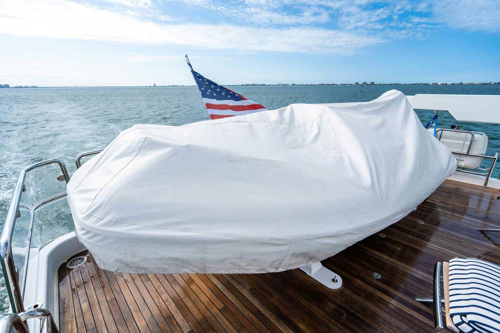 a white umbrella on a boat aboard LEGACY Yacht for Sale