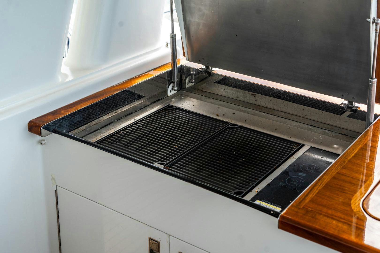 a black and white electric piano aboard LEGACY Yacht for Sale