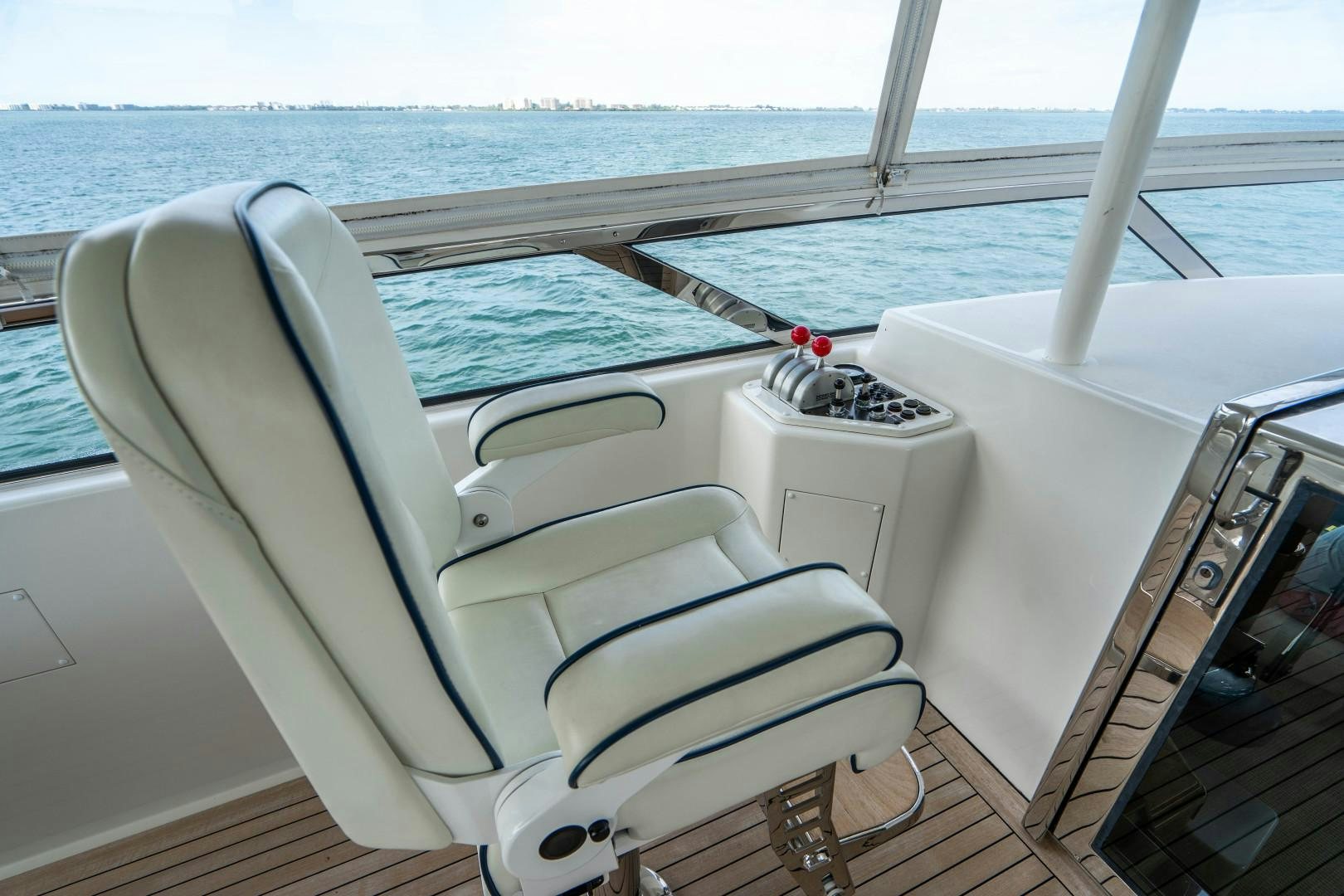 a white chair on a boat aboard LEGACY Yacht for Sale