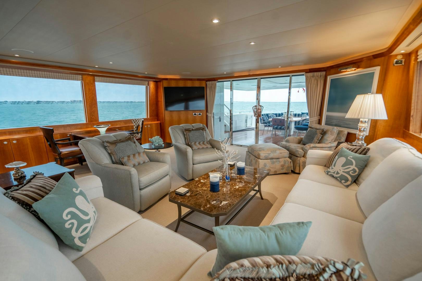 a living room with a large window aboard LEGACY Yacht for Sale
