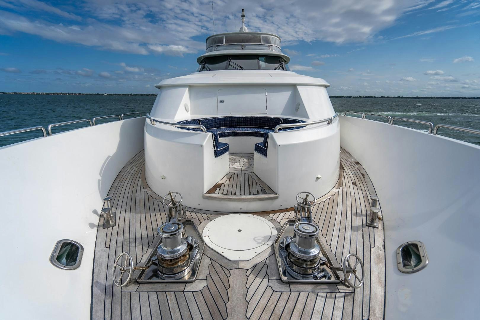 a white boat on a deck aboard LEGACY Yacht for Sale