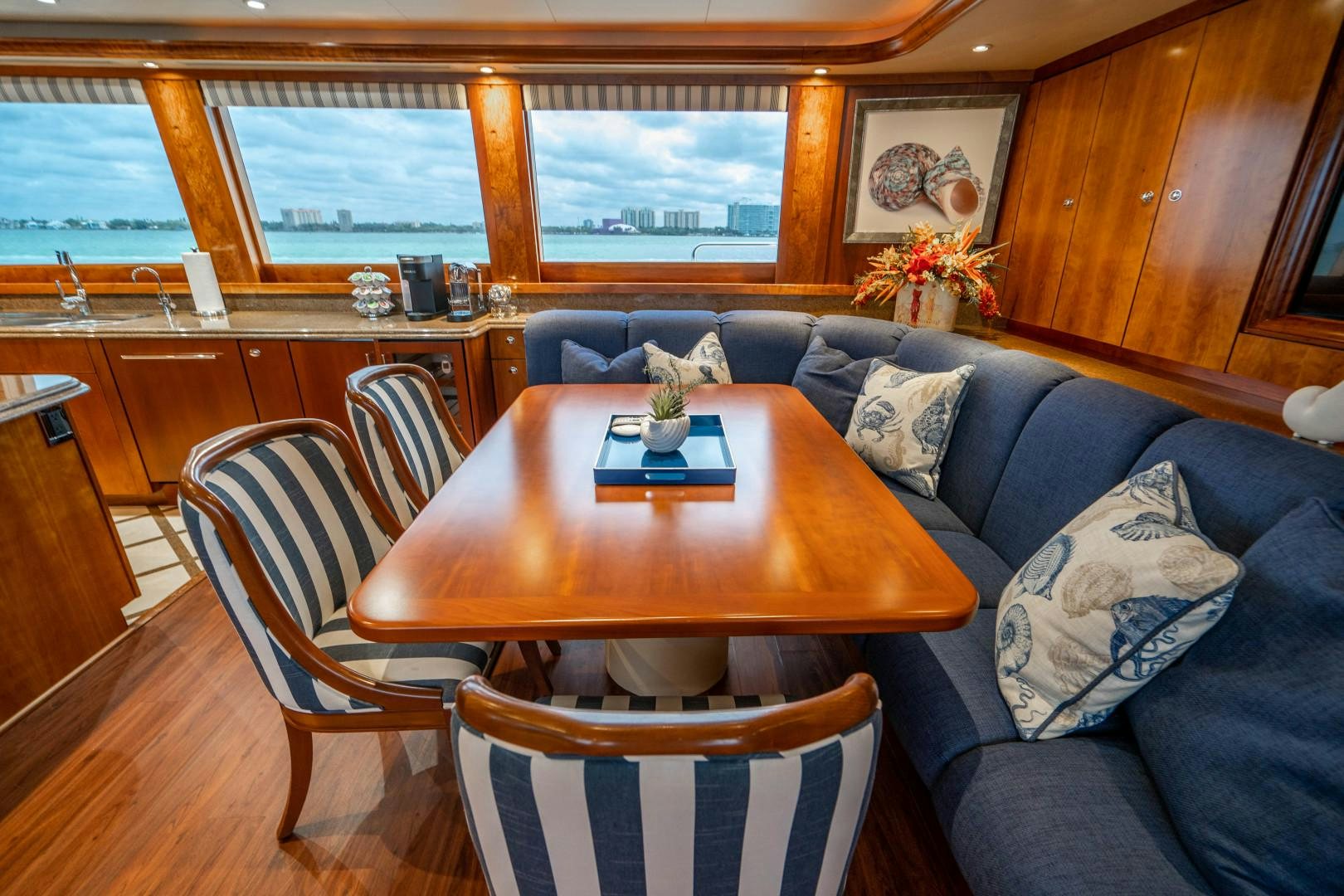 a living room with a couch and a table aboard LEGACY Yacht for Sale