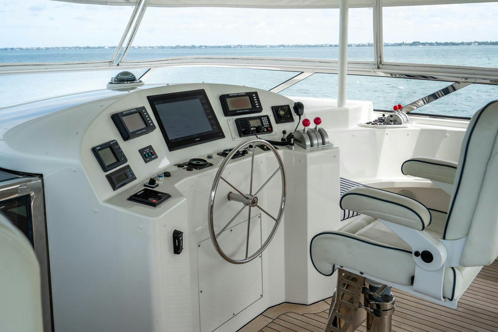 a boat with a screen and a computer on it aboard LEGACY Yacht for Sale