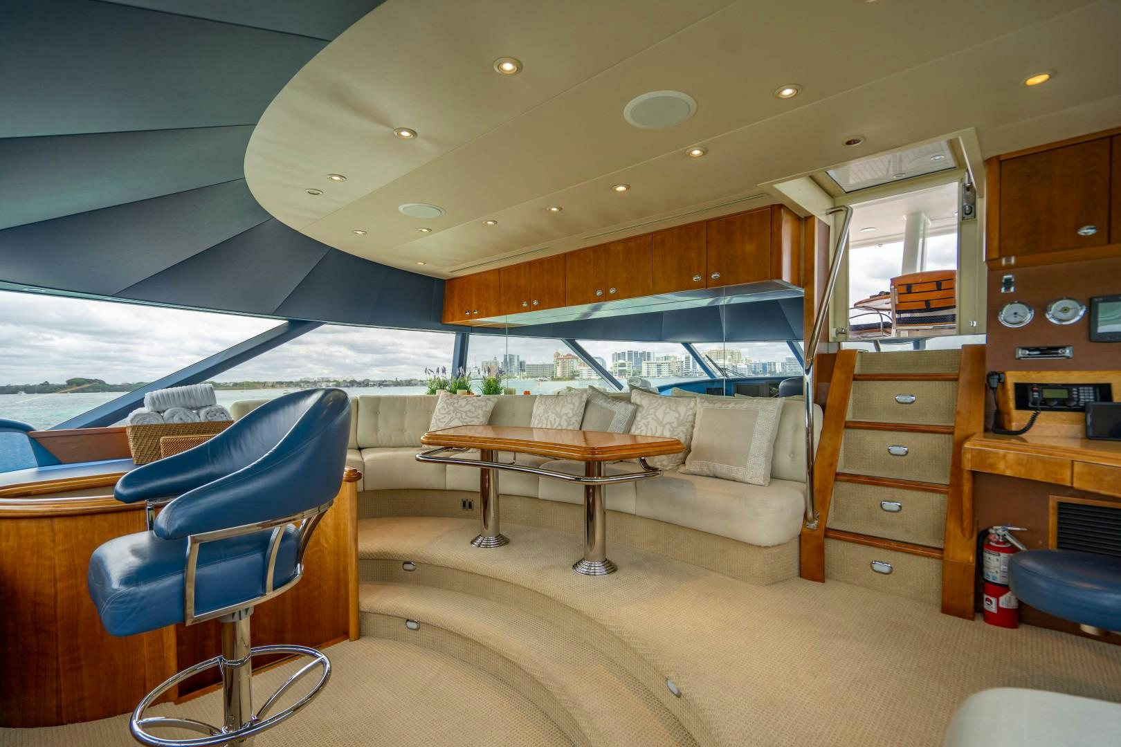 a room with a bed and a table aboard LEGACY Yacht for Sale