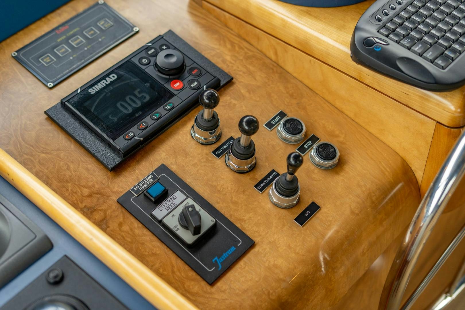 a table with a keyboard and a game controller on it aboard LEGACY Yacht for Sale