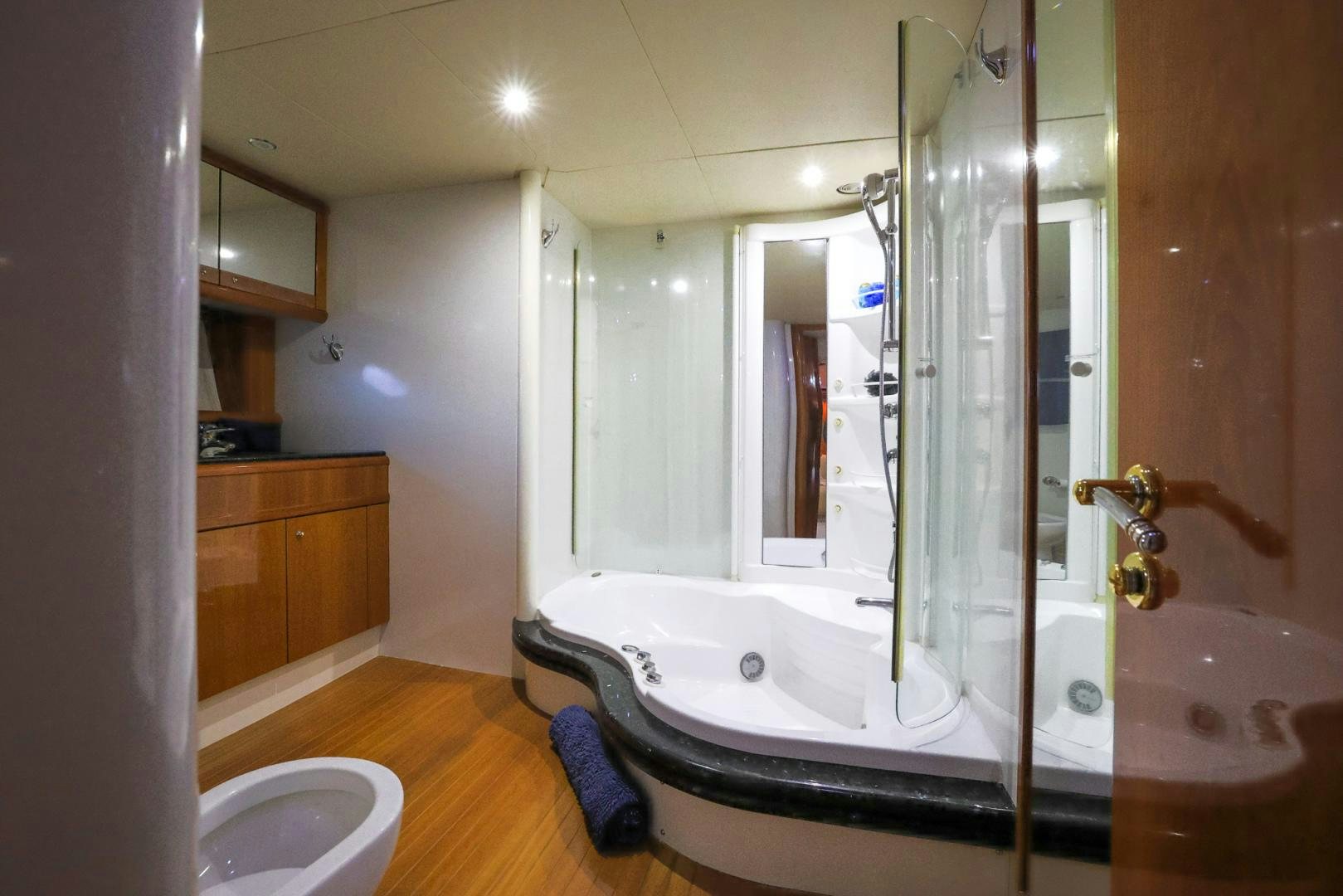 a bathroom with a tub sink and a shower aboard SIROCCO Yacht for Sale