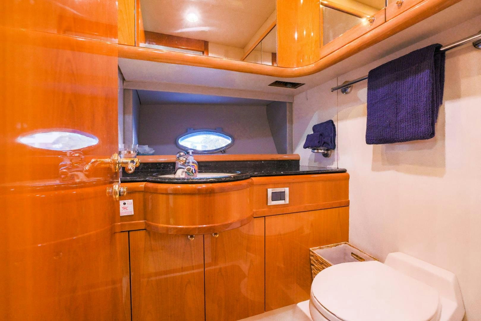 a bathroom with a sink and toilet aboard SIROCCO Yacht for Sale
