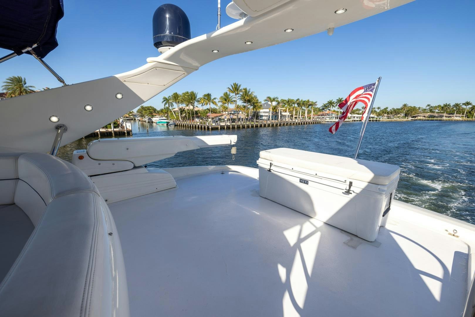 a boat with a flag on the front aboard SIROCCO Yacht for Sale
