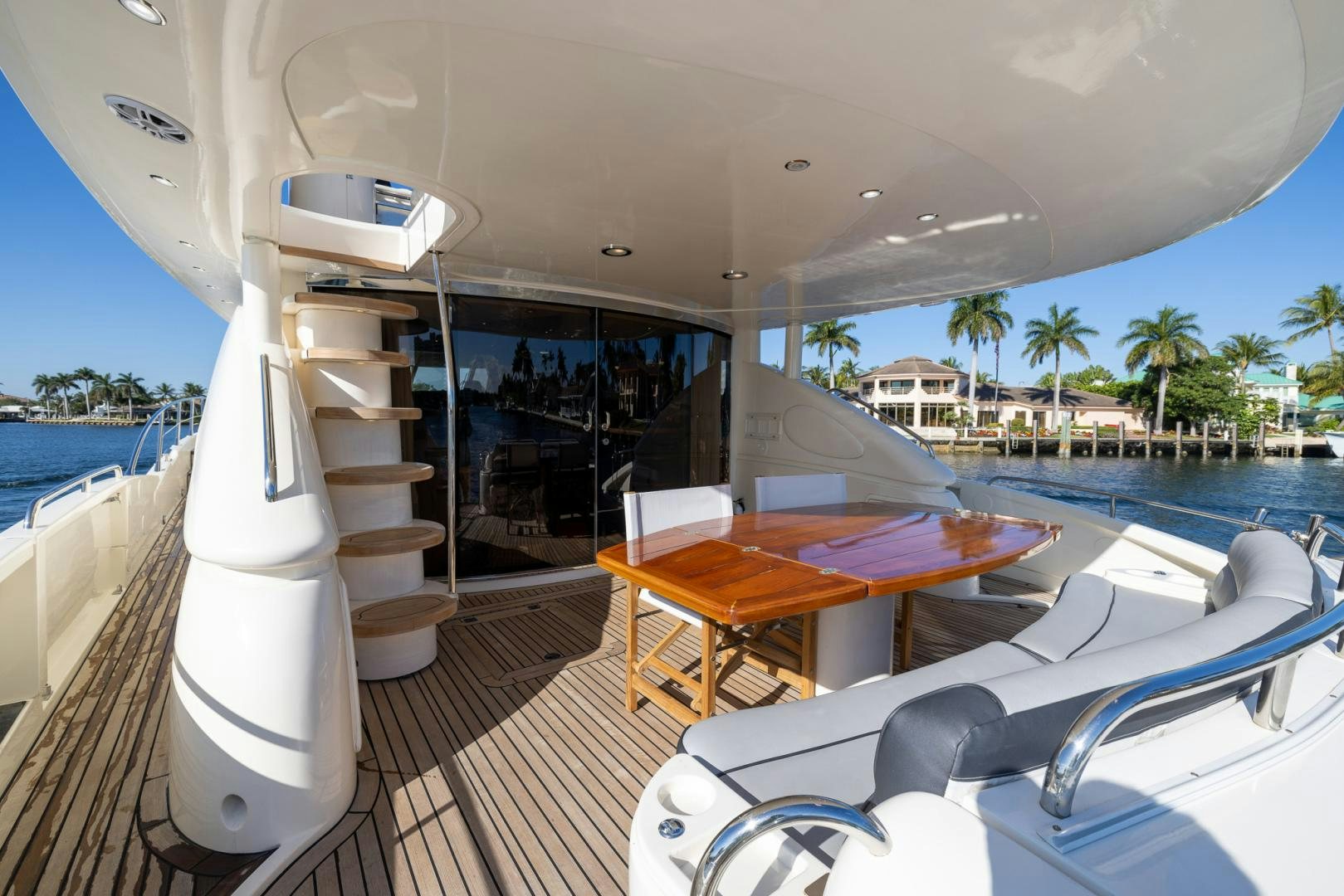 a boat with a table and chairs aboard SIROCCO Yacht for Sale