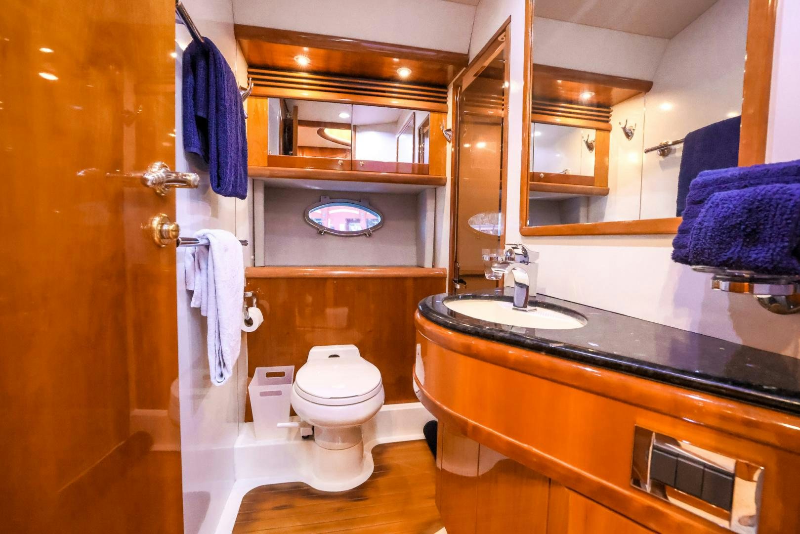 a bathroom with a toilet and sink aboard SIROCCO Yacht for Sale
