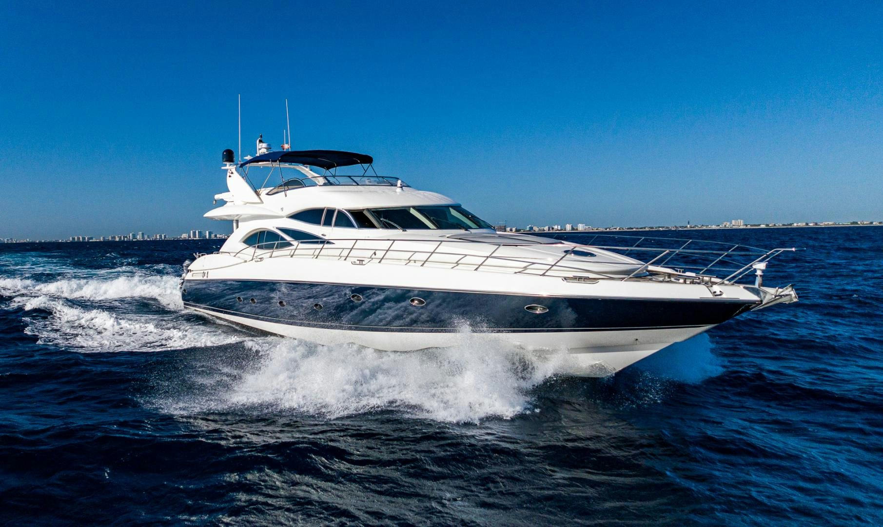 a white yacht on the water aboard SIROCCO Yacht for Sale