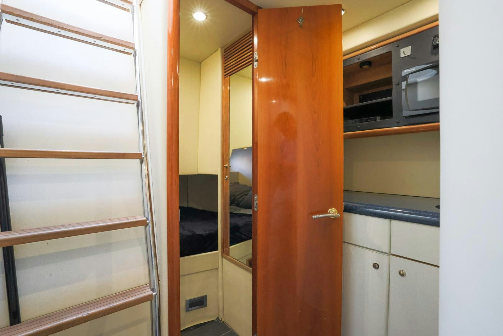 a room with a door and cabinets aboard SIROCCO Yacht for Sale