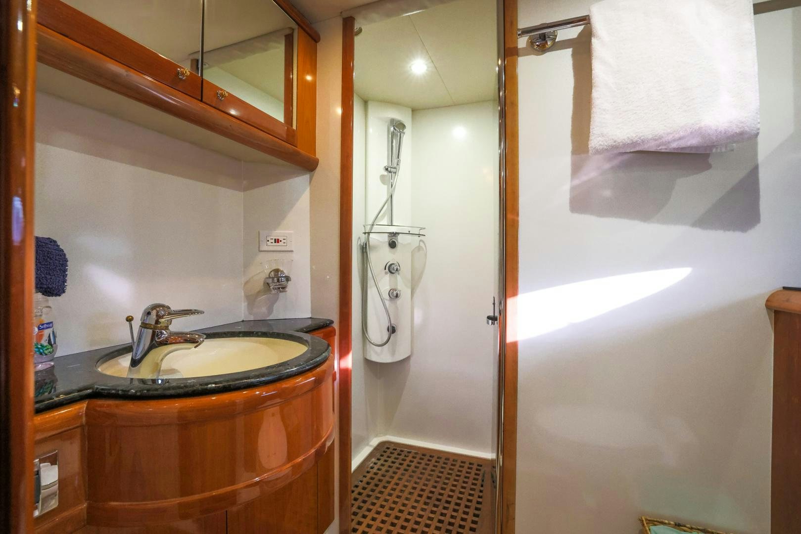 a bathroom with a sink and a mirror aboard SIROCCO Yacht for Sale