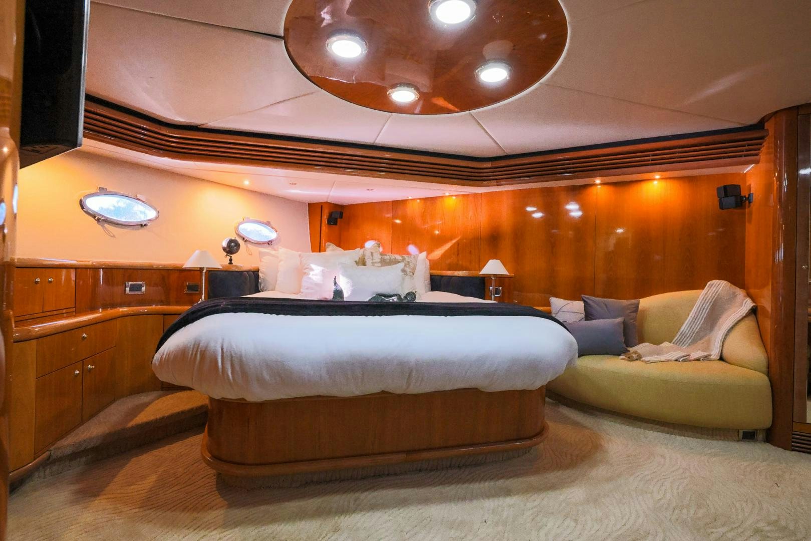 a room with a bed and a couch aboard SIROCCO Yacht for Sale