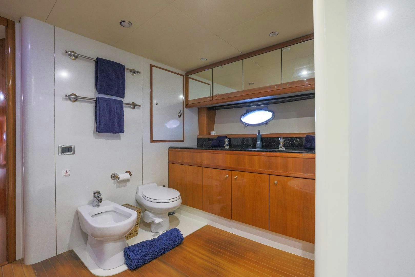 a bathroom with a toilet and a sink aboard SIROCCO Yacht for Sale
