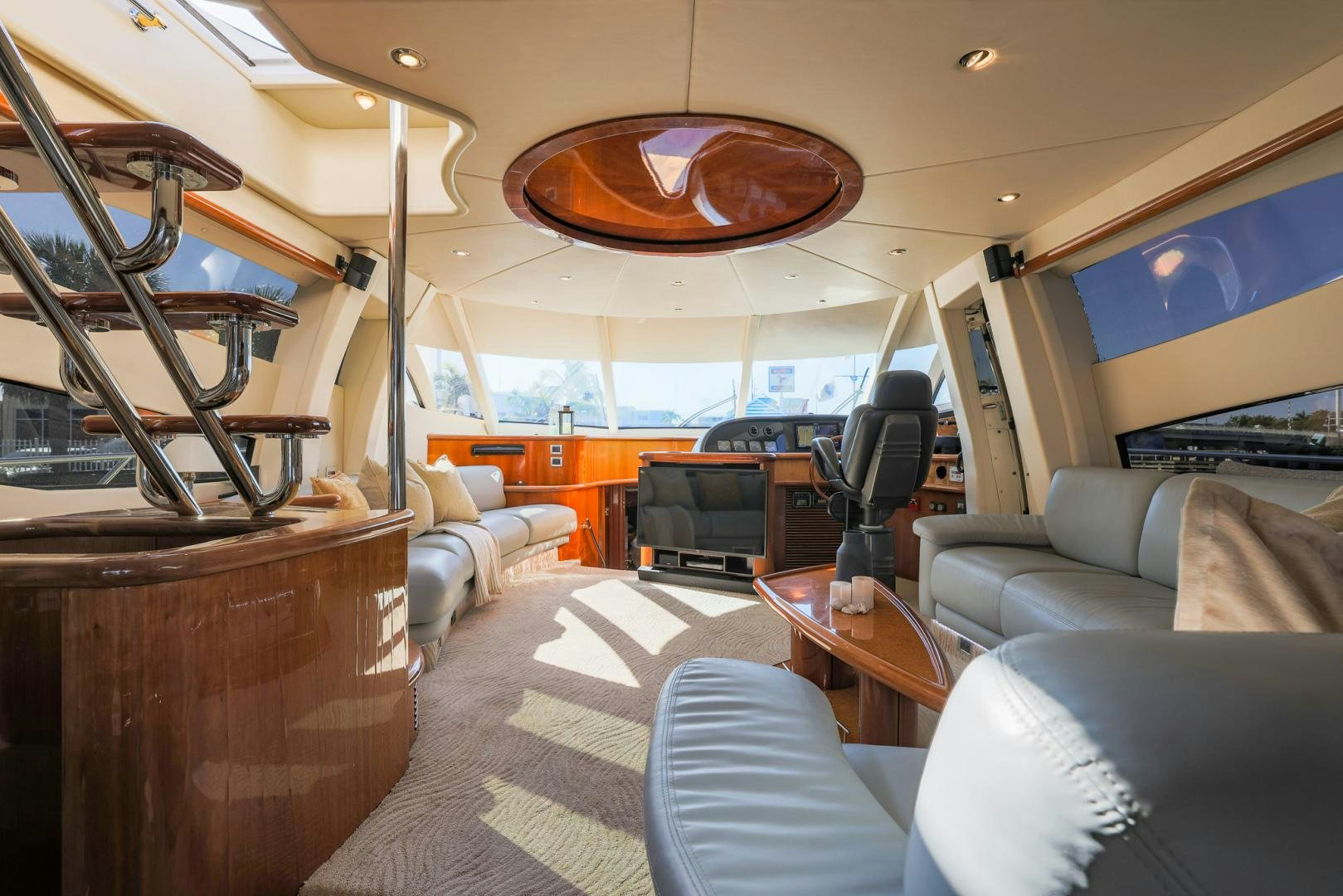 a room with a couch and a television aboard SIROCCO Yacht for Sale