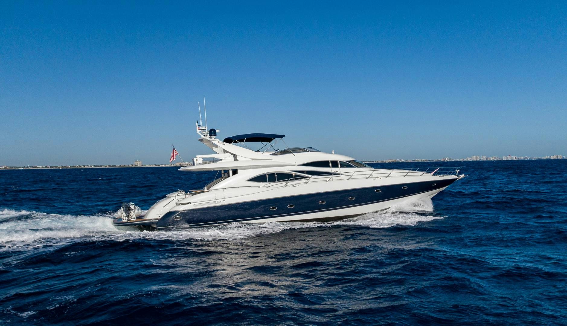 a white yacht on the water aboard SIROCCO Yacht for Sale